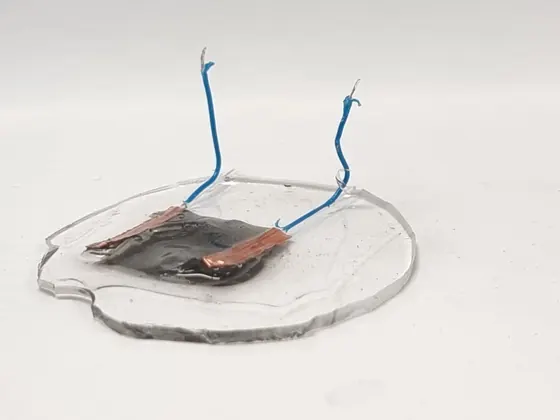 An early copper coil sensor prototype on a clear substrate